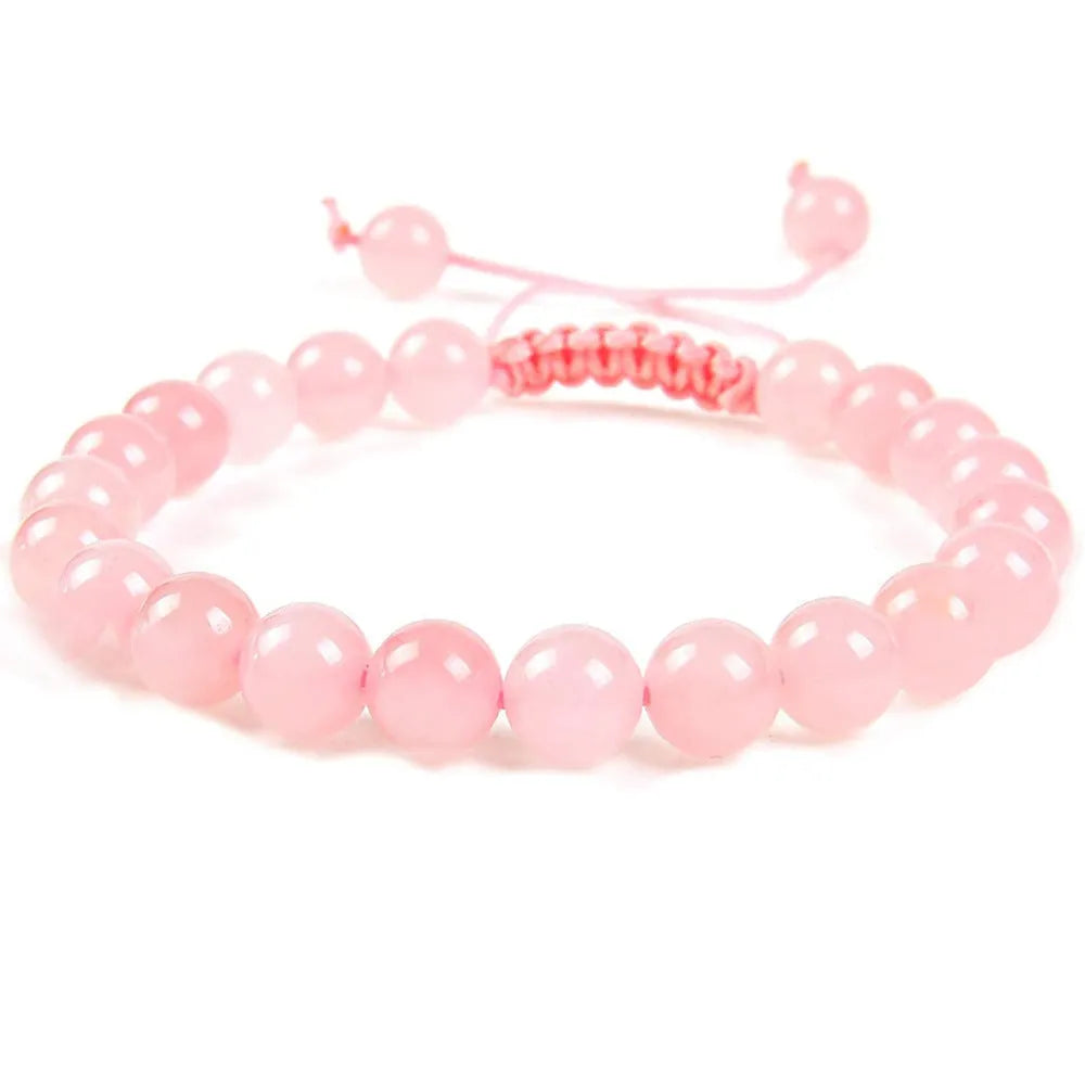 Women's flat knot braided healing bracelet with natural aquamarine stone, hand-woven geometric design on white background