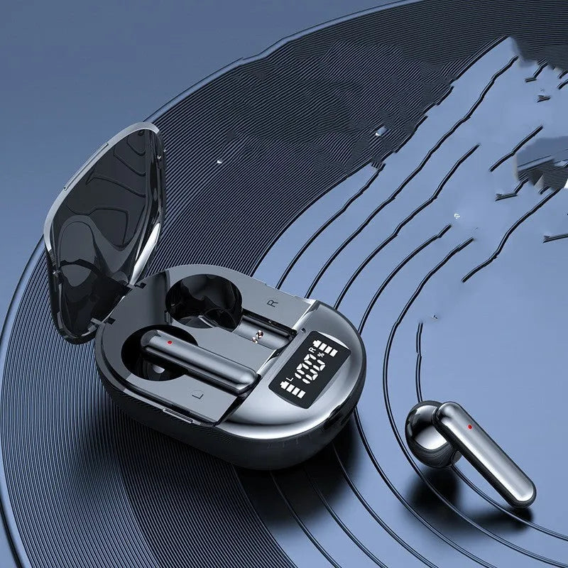 Black and white wireless Bluetooth headset with digital display screen and charging bin