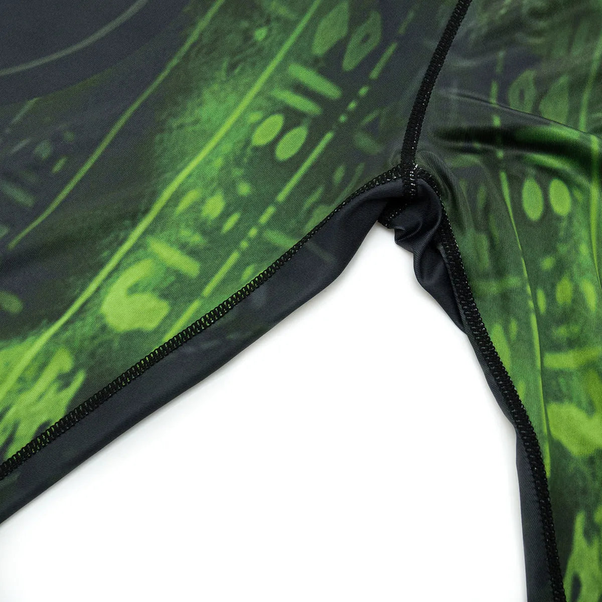 Man wearing a slim-fit, long-sleeve printed sports suit for running and outdoor activities.