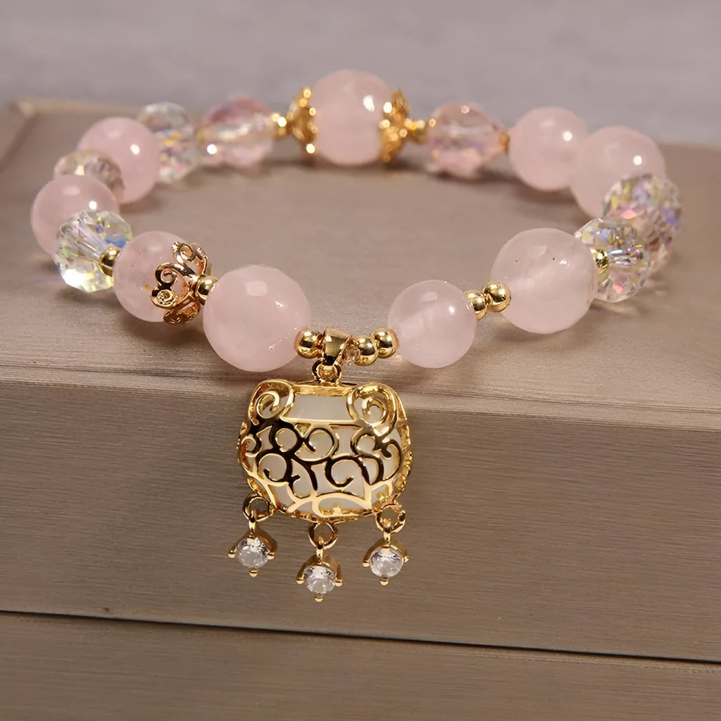 Women's yellow agate crystal bracelet with adjustable gold silk cord on wrist