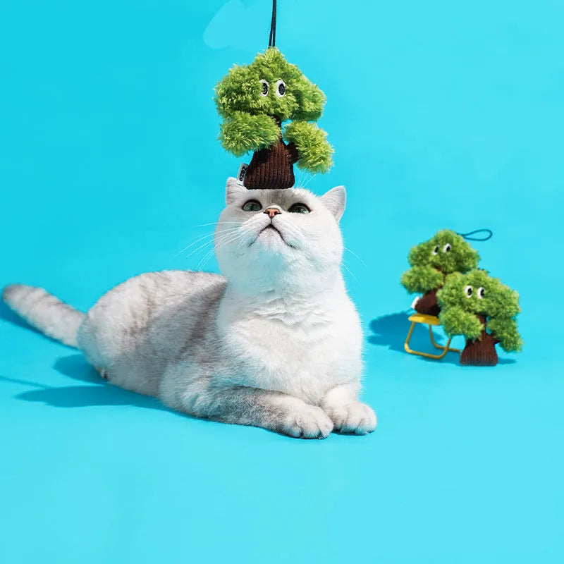Pine tree shaped fabric cat toy with mint stick inside, measuring 10cm long