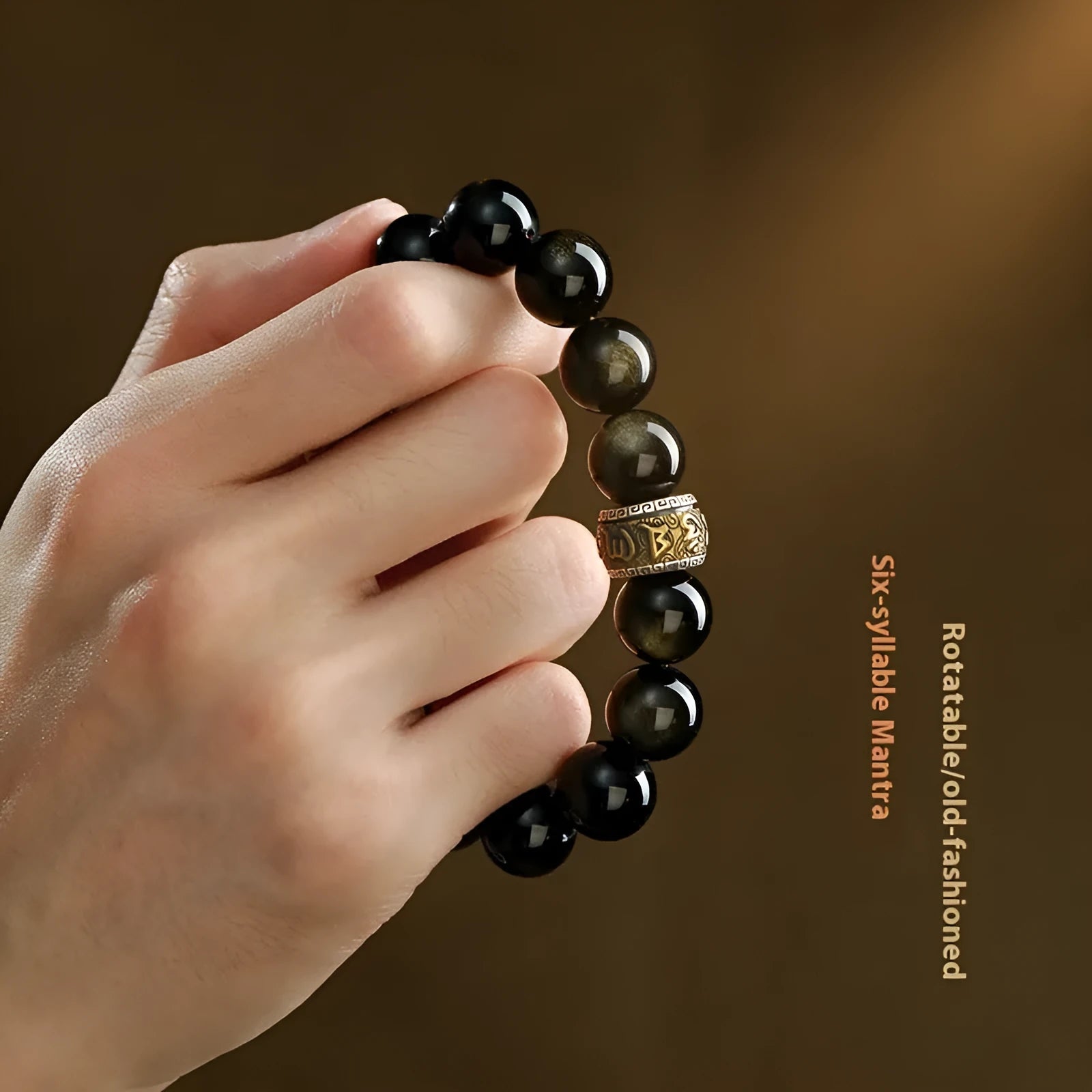 Natural cinnabar bead bracelet with carved animal zodiac design in gold obsidian and silver stone on a silver gift box