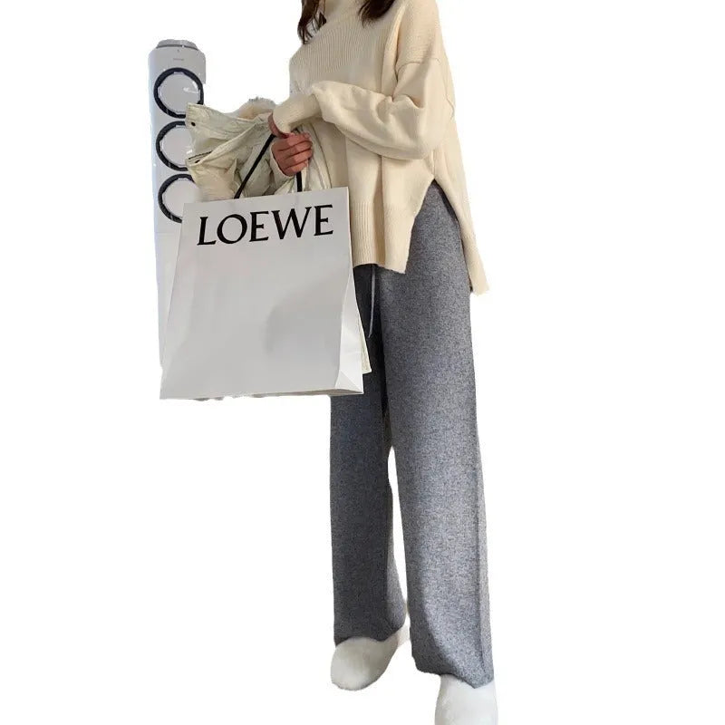 Women's high waist knitted wide-leg trousers in cream white colour with elastic waistband