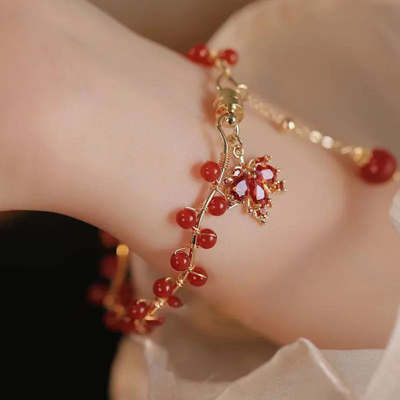 Maple Leaf Girl red ginkgo leaf magnetic bracelet on wrist, electroplated alloy finish