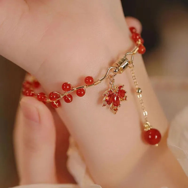 Maple Leaf Girl red ginkgo leaf magnetic bracelet on wrist, electroplated alloy finish