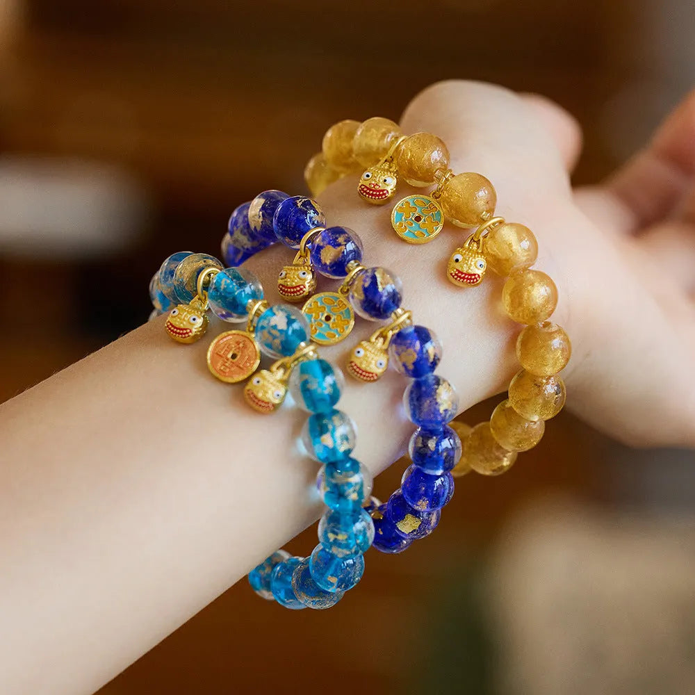 Handmade coloured glaze bracelet with gold foil swallowing gold beast motif, fragrant grey tone, geometric shape, unisex Chinese national style