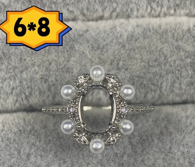 Oval denier copper ring with 6x8mm stone and star design on an open mouth band.
