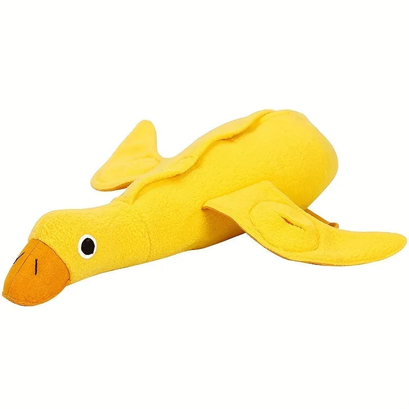 Yellow plush teddy duck dog toy with sound mechanism and treat leak hole for pet training