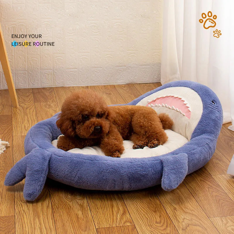 Blue shark pattern pet bed for dogs and cats with raised sides and non-slip base.