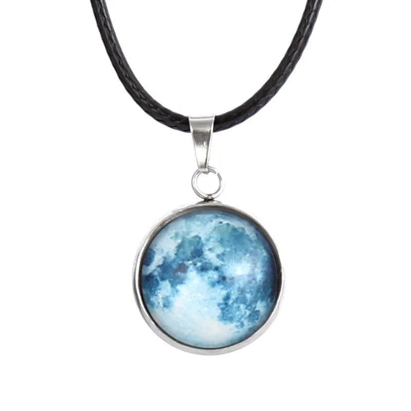 Luminous alloy pendant necklace with Christmas moon, night sky, and constellation design on a glass centrepiece.