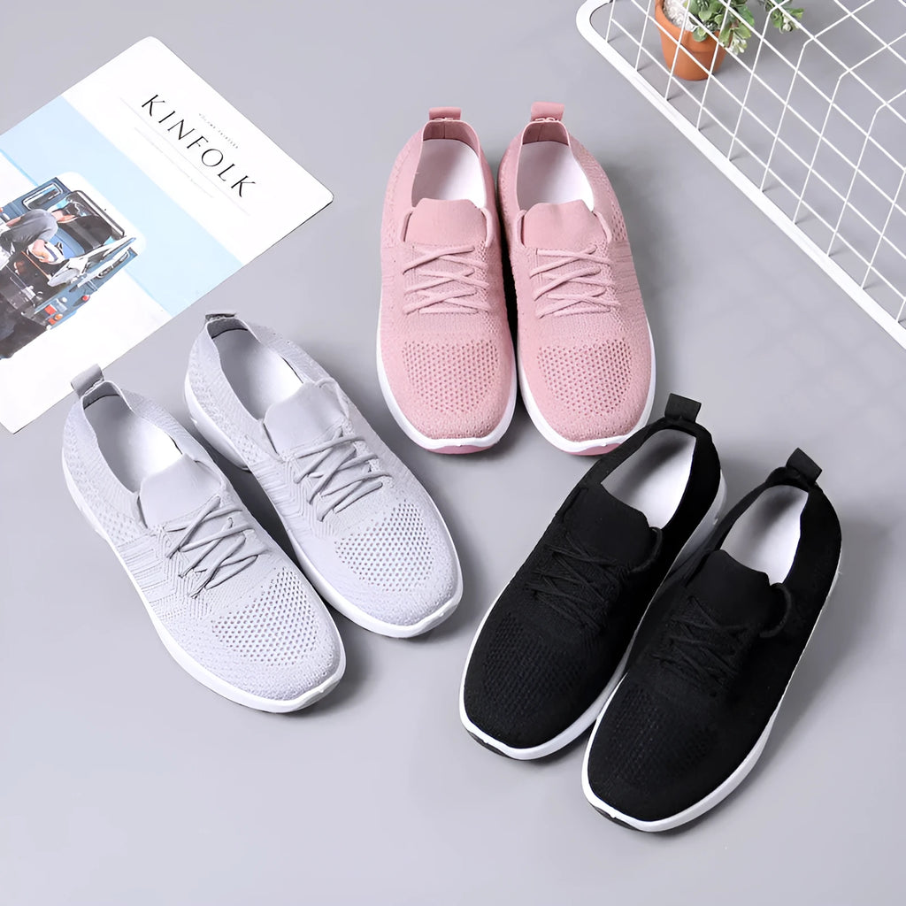 Women's black mesh lace-up sneakers with a soft sole on a white background.