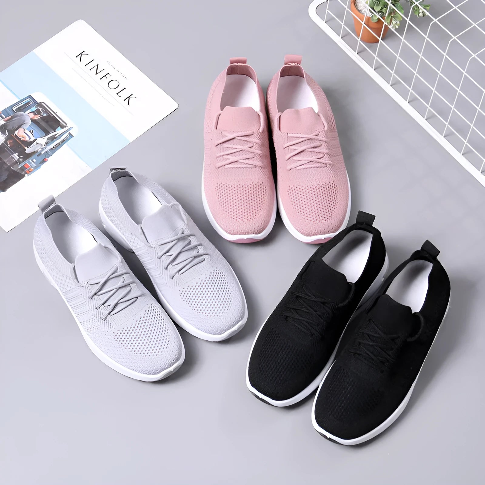 Women's black mesh lace-up sneakers with a soft sole on a white background.