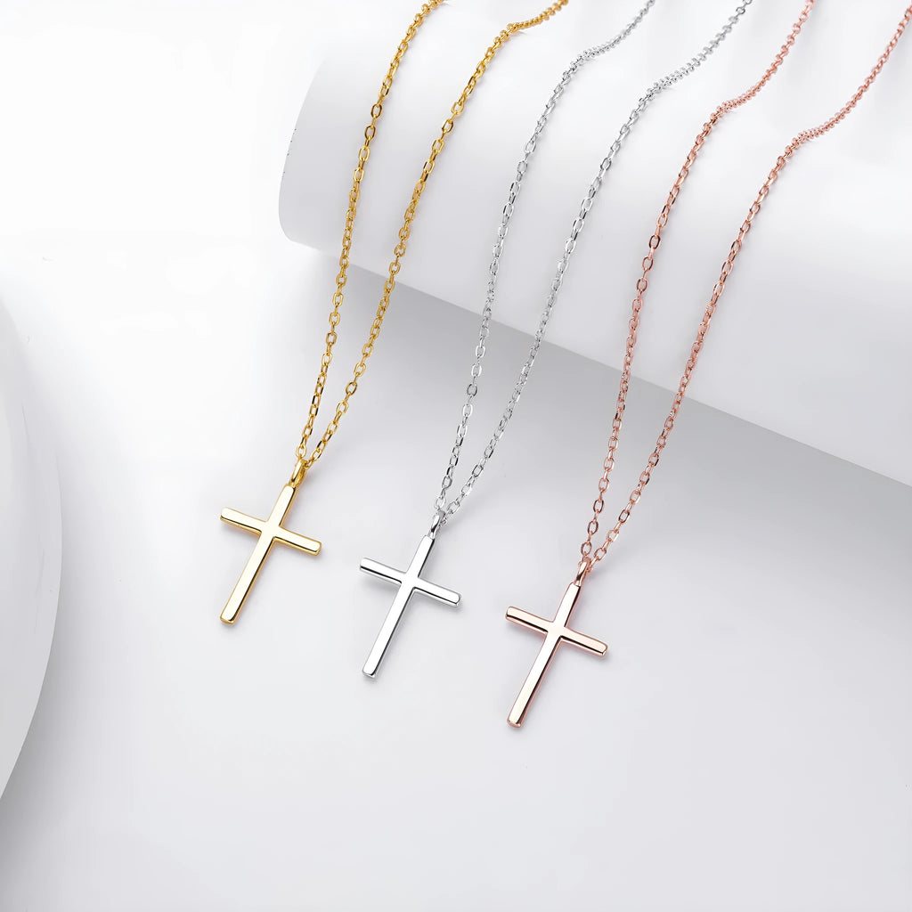 Simple glossy cross pendant on an O-chain sterling silver necklace in gold plating.