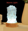 Mini amethyst tooth flower night light with USB plug-in showing purple crystal and warm glow
