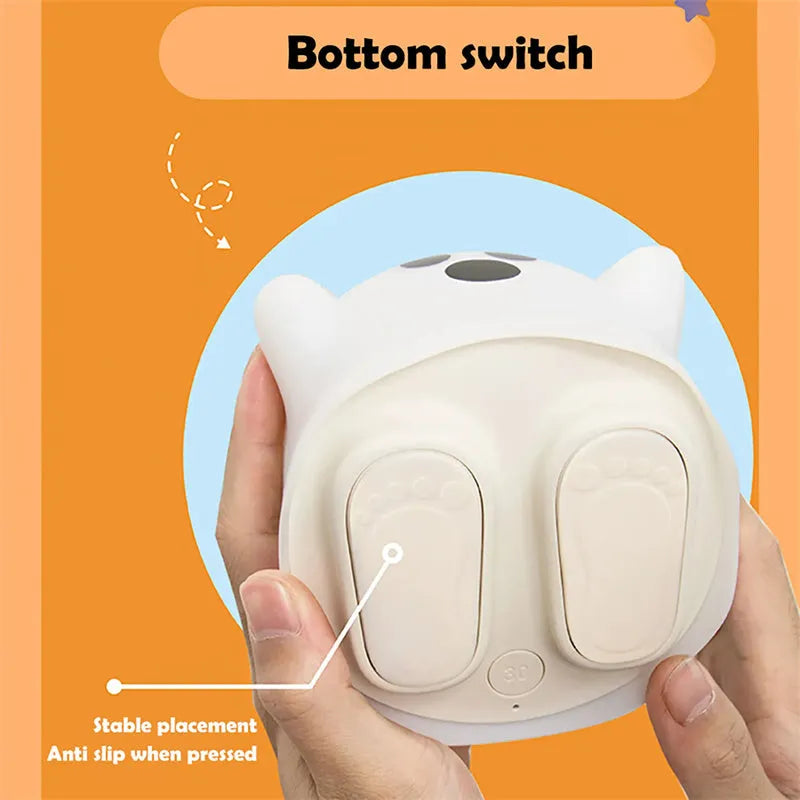 Silicone night light in Ah Ah style on a bedside table with soft glow