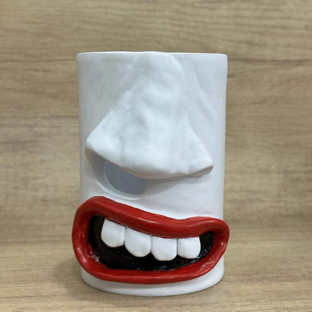 Resin tissue box holder with colourful humorous American style artwork measuring 8.5cm by 14.6cm