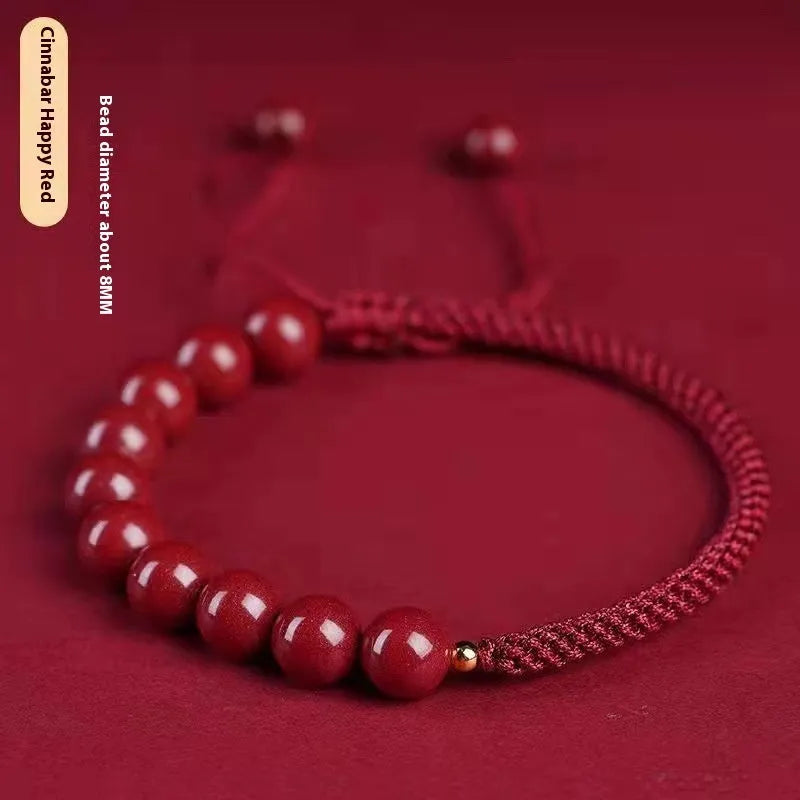 Braided rope bracelet with cinnabar beads in 8mm diameter and wine red colour