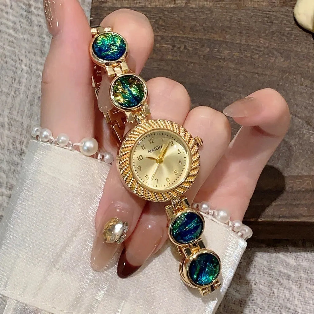 Women's quartz watch with 25mm round dial in zinc alloy case, showing spiral crown and choice of six colours.
