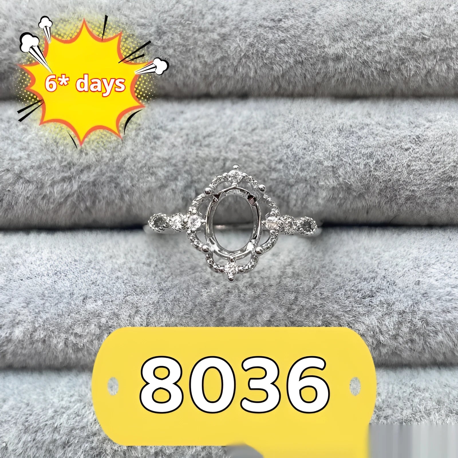 Oval denier copper ring with 6x8mm stone and star design on an open mouth band.