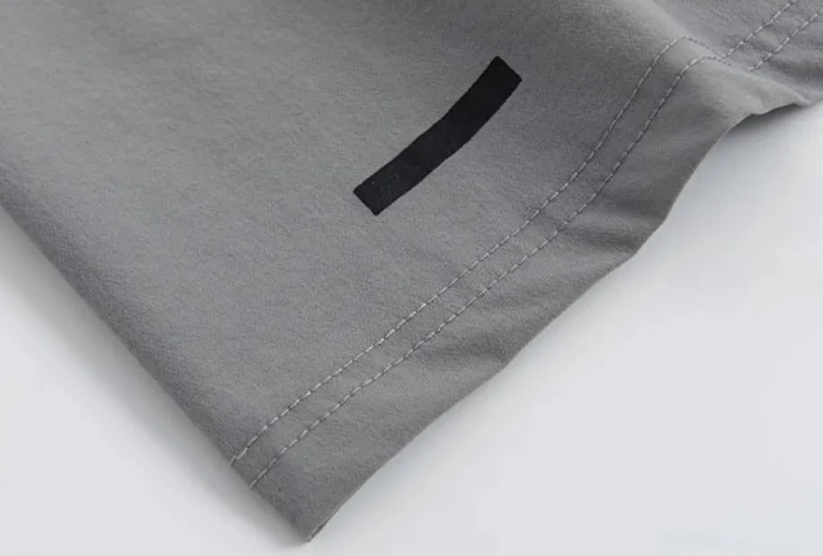 Loose cropped sports trousers in grey with printed waistband, moisture-wicking fabric for women