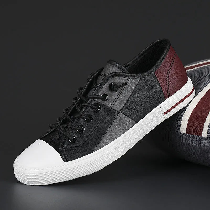 Men's black and white leather pumps with elastic band, round toe, and flat vulcanised rubber sole.