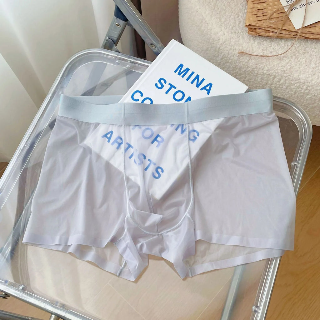 Men's thin grey seamless boxer shorts made from quick-drying nylon fabric, laid flat.