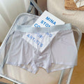 Men's thin grey seamless boxer shorts made from quick-drying nylon fabric, laid flat.