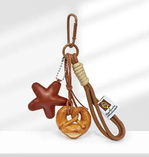Handmade soda bread design handbag pendant with brown strap and five-pointed star