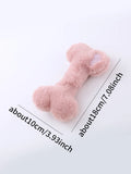 Blue pink and yellow plush bone dog toy with a textured grinding teeth surface.