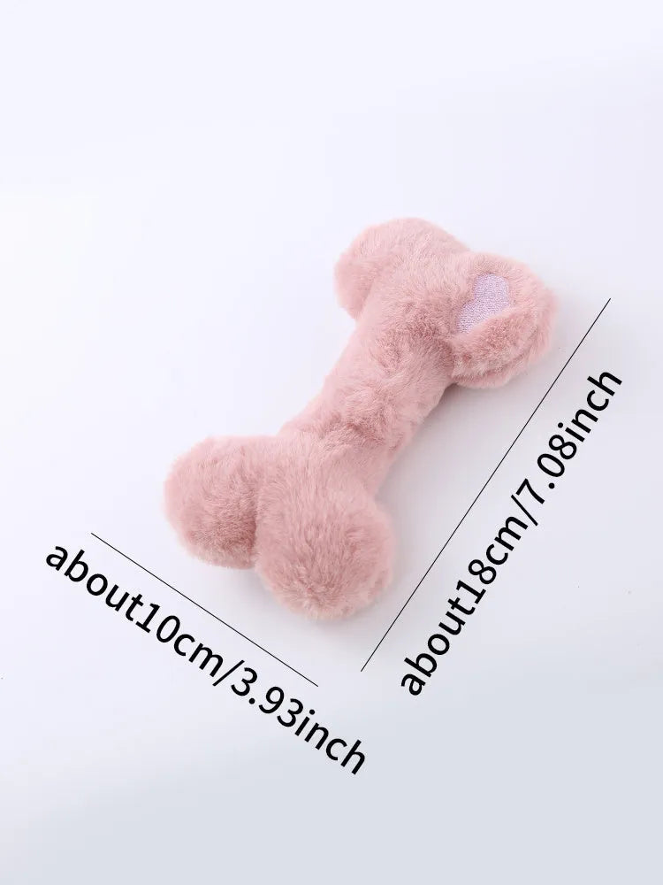 Blue pink and yellow plush bone dog toy with a textured grinding teeth surface.