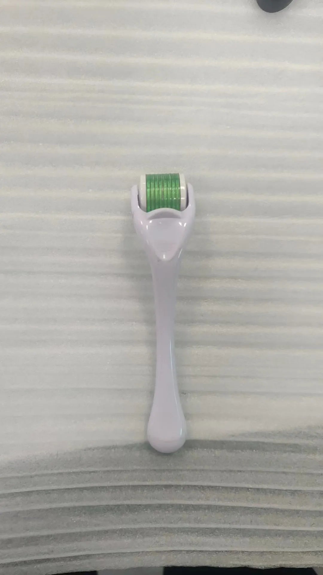 540 needle derma roller with black handle and coloured wheel, showing 0.25mm 0.3mm size options for micro-needling.