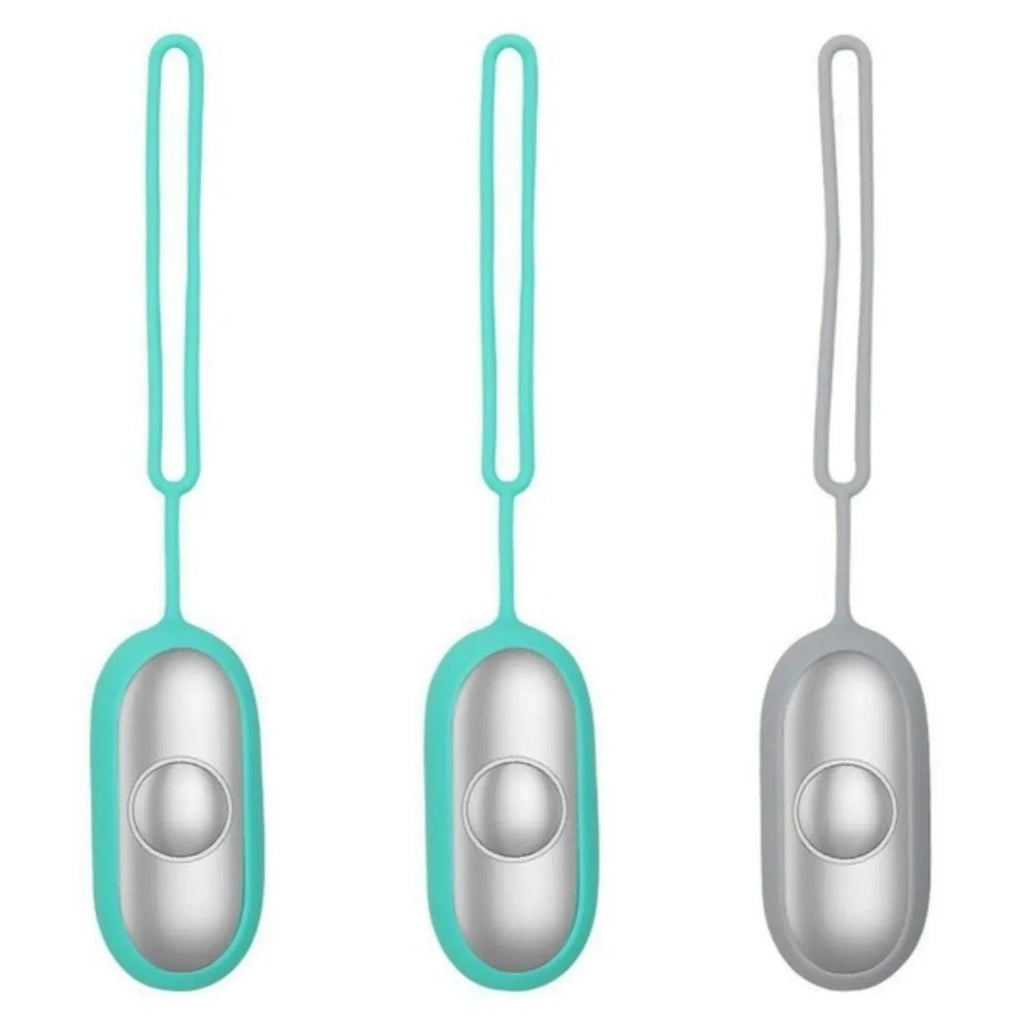 Hand-held micro-current sleep aid device with round button and stainless steel electrodes in grey colour