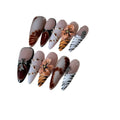 Leopard print false nails with cross and flower designs, shown in long wear armour style