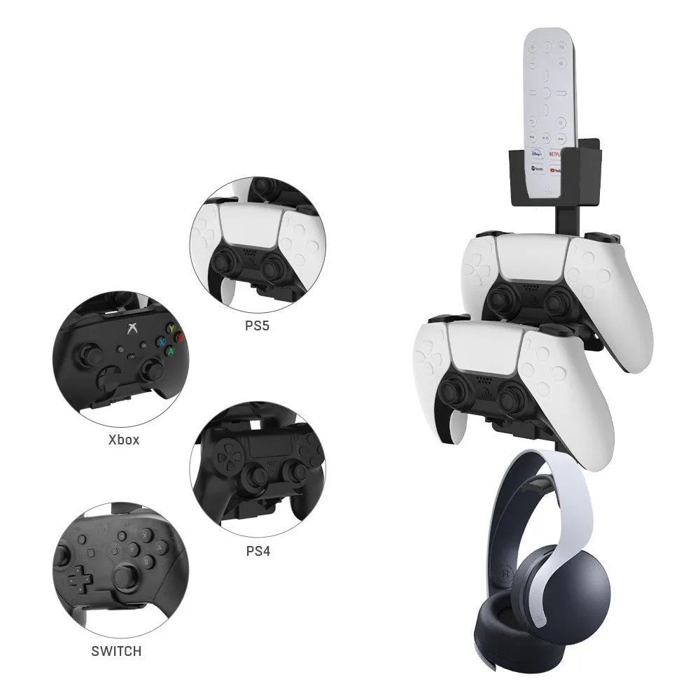 White ABS plastic wall hook holding a black game controller and TV remote.