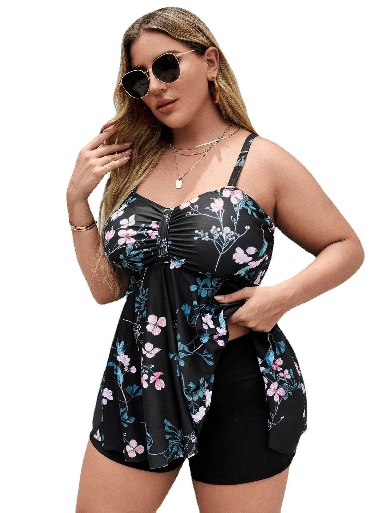 Women's floral print one-piece swimsuit on a hanger, showing split colour design.