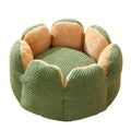 Green cactus petal shaped cat bed cave design with soft plush surface and non-slip bottom on hardwood floor