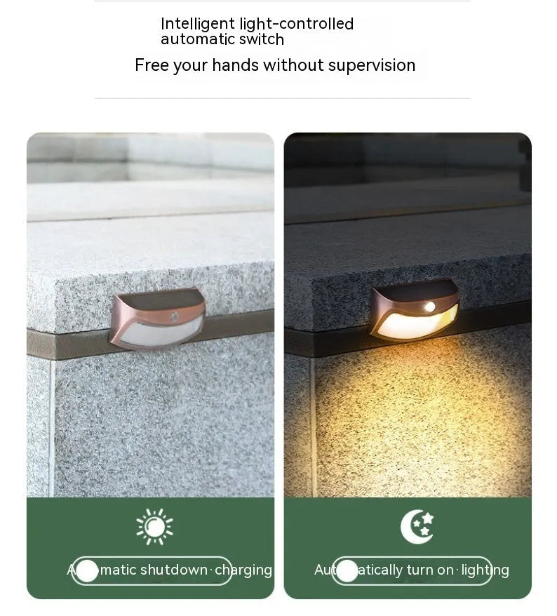 Solar outdoor garden wall lamp with smiling face design for courtyard lighting