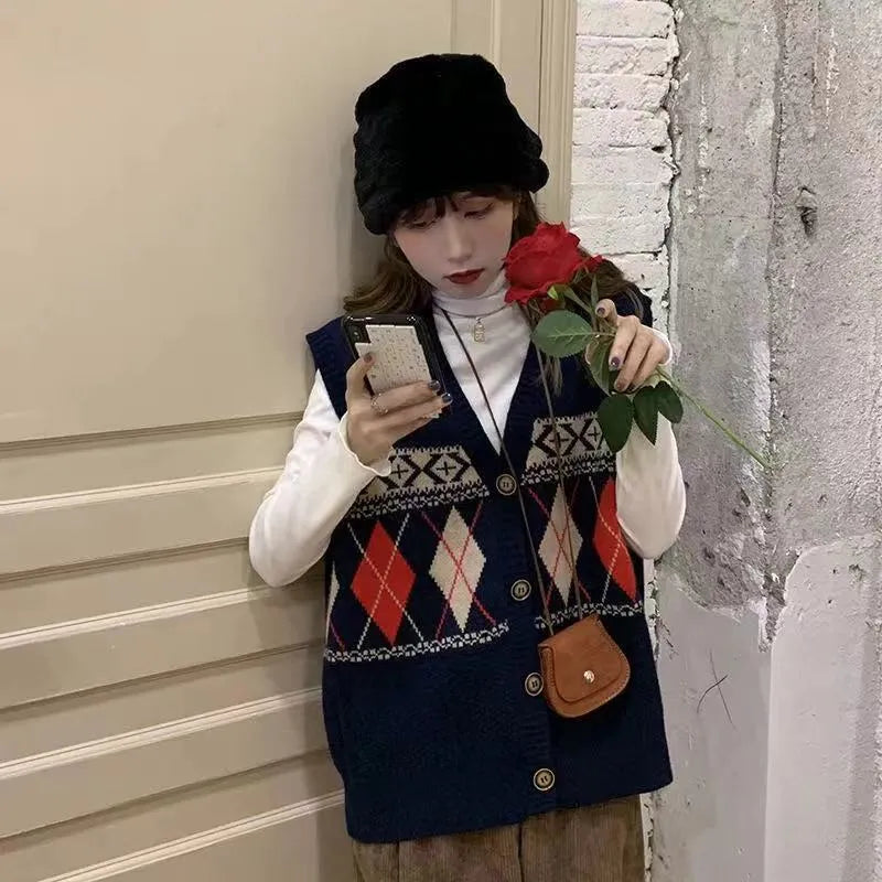 Loose diamond plaid sleeveless cardigan top in khaki colour showing front view