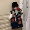Loose diamond plaid sleeveless cardigan top in khaki colour showing front view