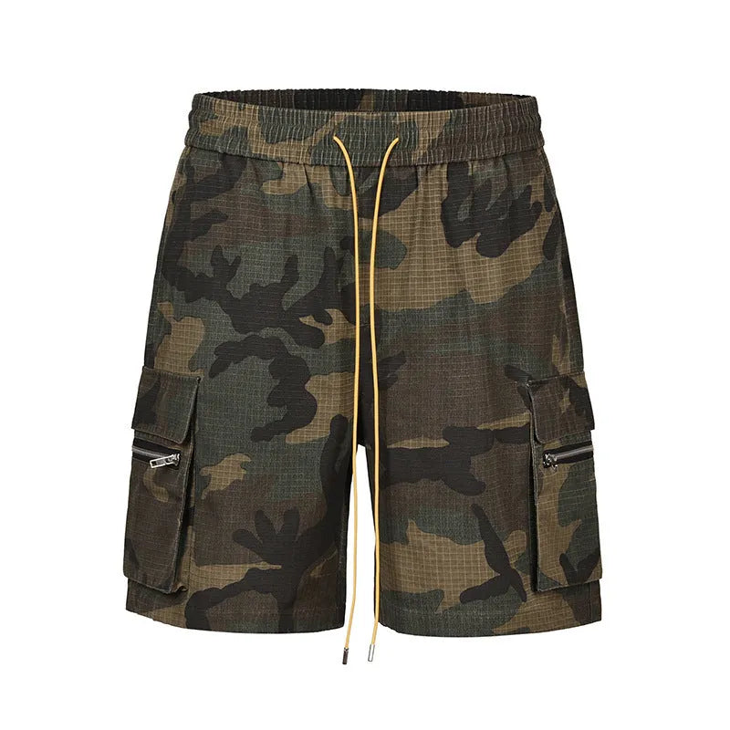 Multi-pocket camouflage workwear shorts for men with mid-waist cropped design and thin fabric, shown in a flat lay.