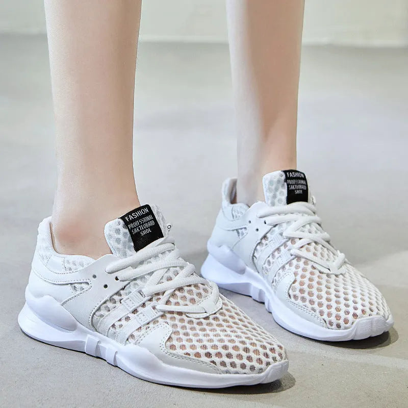 Low-top mesh sneakers in white with a hollow-out EVA sole design on a solid colour background.
