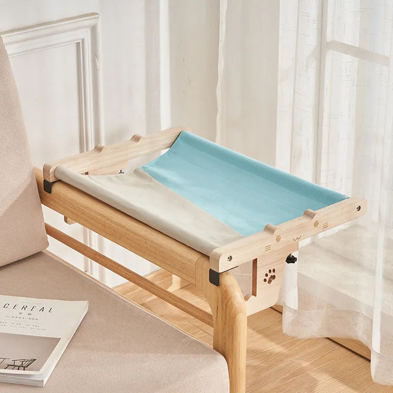 Wooden frame cat hanging bed with patterned removable cushion mounted on window