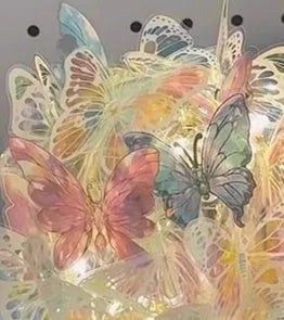 Butterfly night light with glass shade on raw wood base, measuring 12x15cm