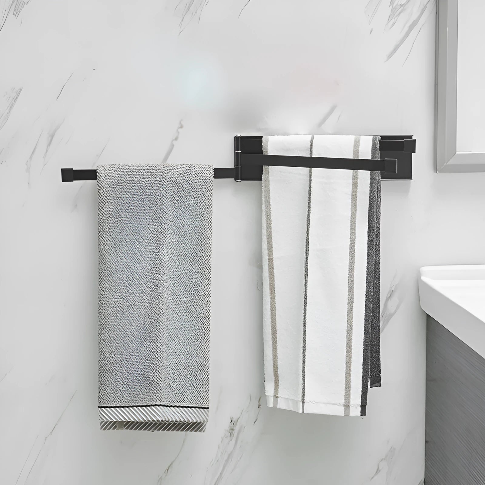 Nordic folding carbon steel towel bar in black mounted on bathroom wall
