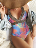 Women's deep V spaghetti strap one-piece swimsuit in polyester with printed pattern, available in multiple colours