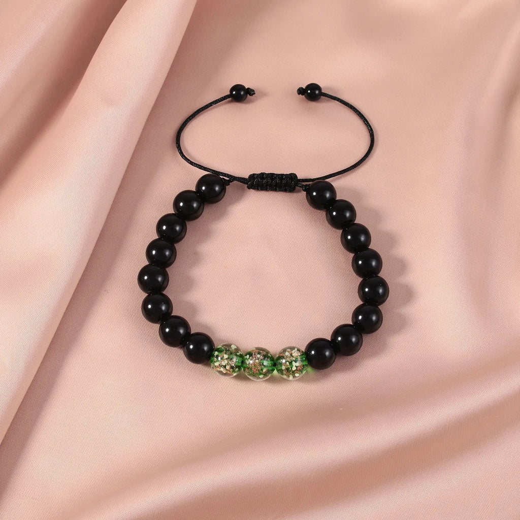 Beaded adjustable luminous bracelet with geometric glass beads in six colours