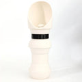 Silicone pet folding water cup shown in open and collapsed states, available in colours like pink, black, and mint green.