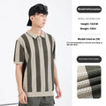 Men's black and white striped short sleeve sweater with zip detail on a hanger
