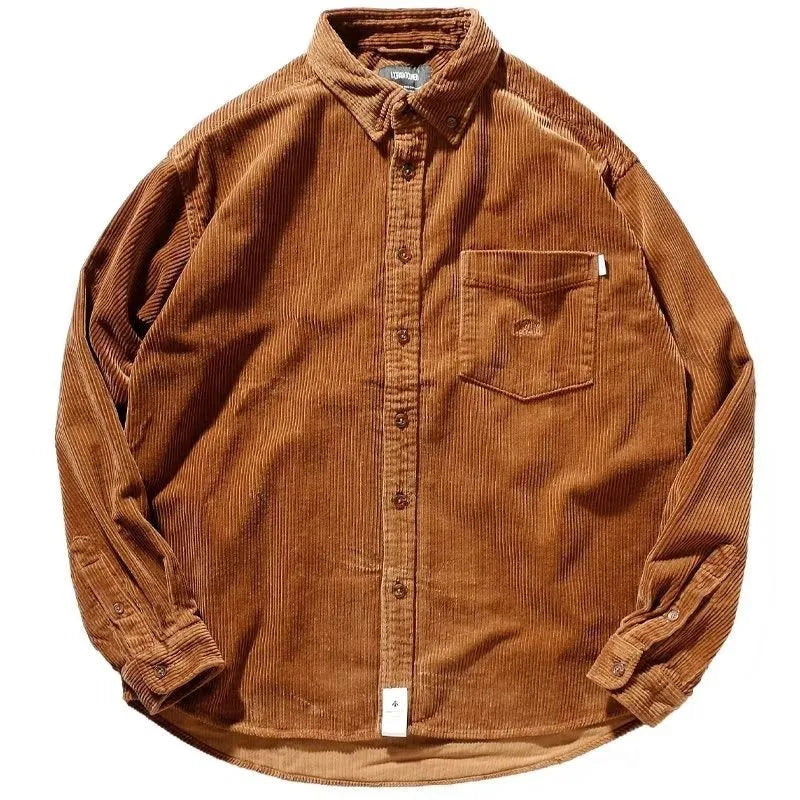 Loose long sleeve corduroy shirt in caramel colour, cardigan style, laid flat.