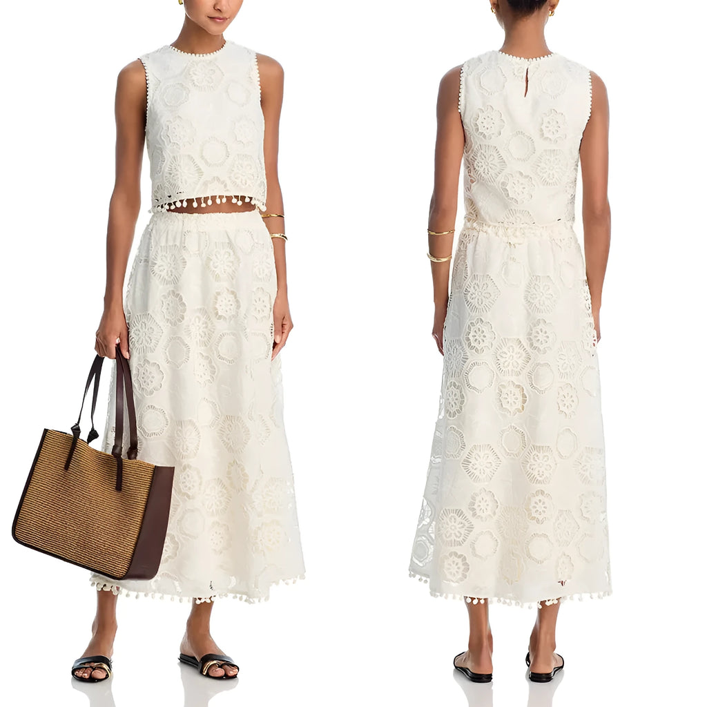 White women's sleeveless suit top with matching embroidered long skirt set